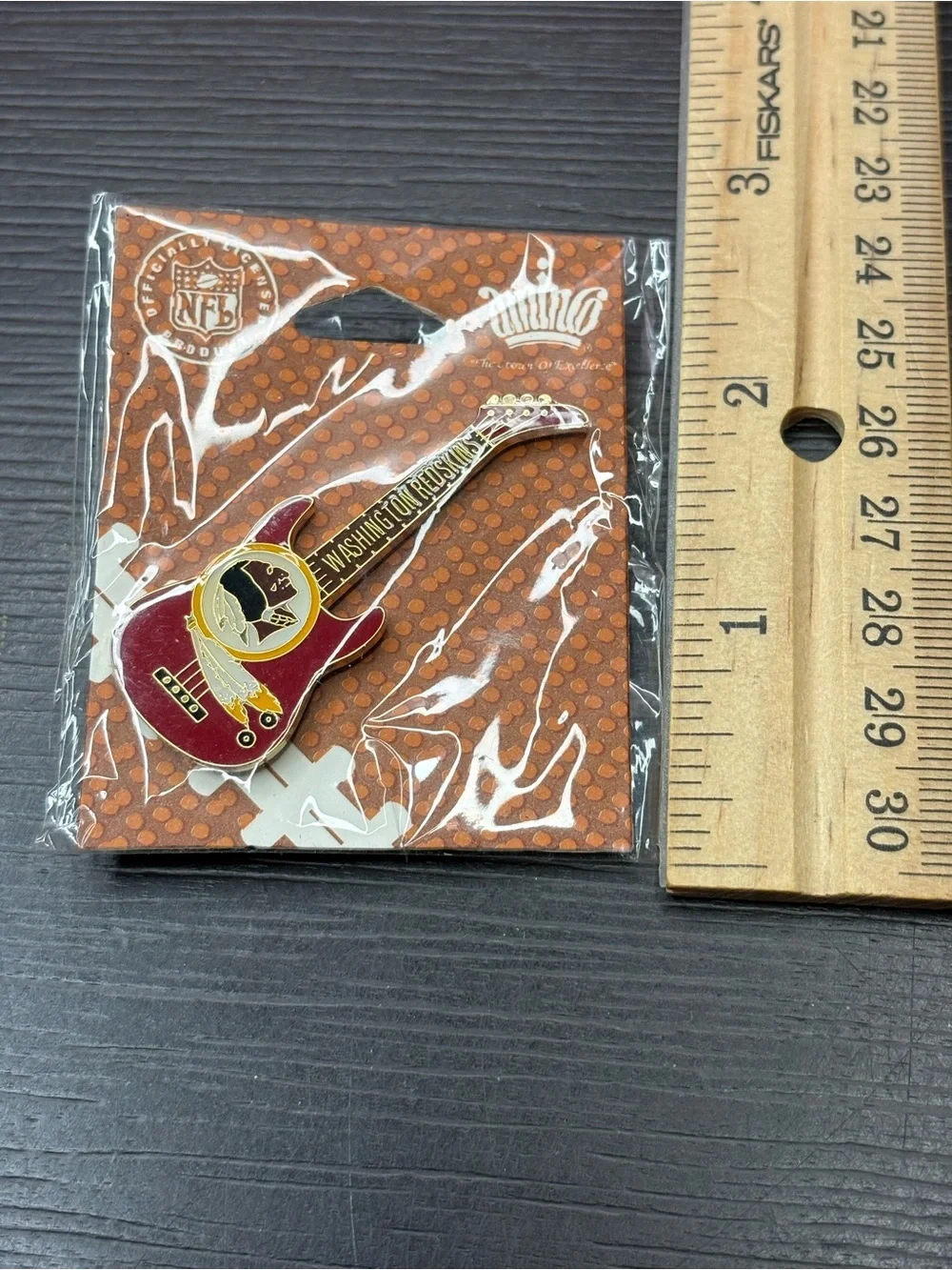 Vintage Washington Redskins guitar shaped lapel pin by Aminco. New old stock